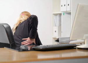 Doctor examining hip joint during pain management for hip pain consultation
