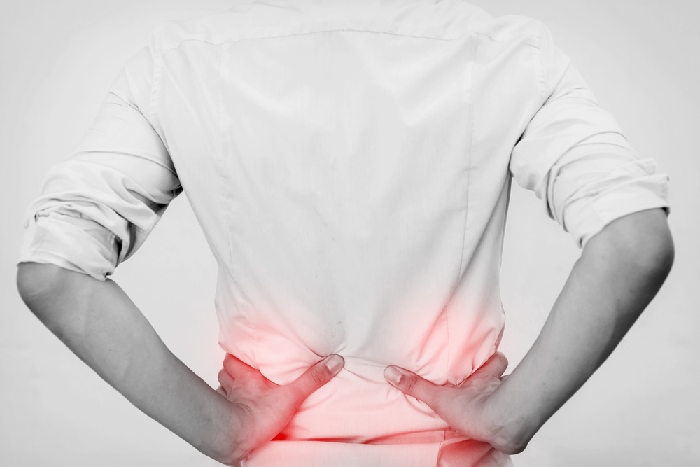 Physical therapist performing hip pain management therapy with patient