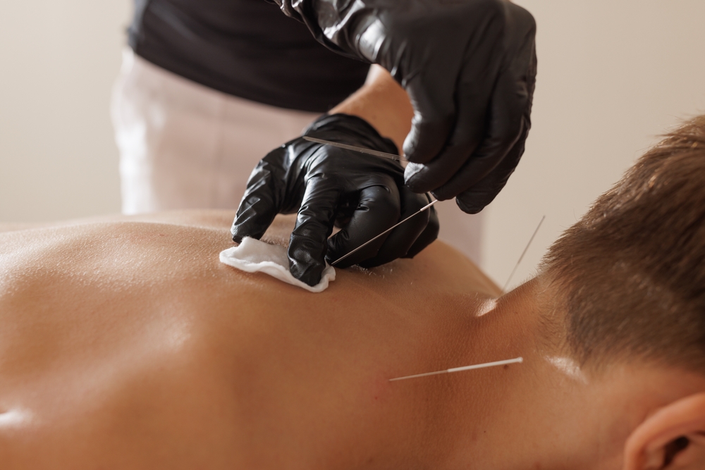 Interventional pain management specialist performing precise injection procedure