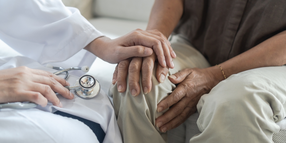 Patient receiving joint pain treatment with therapeutic injection