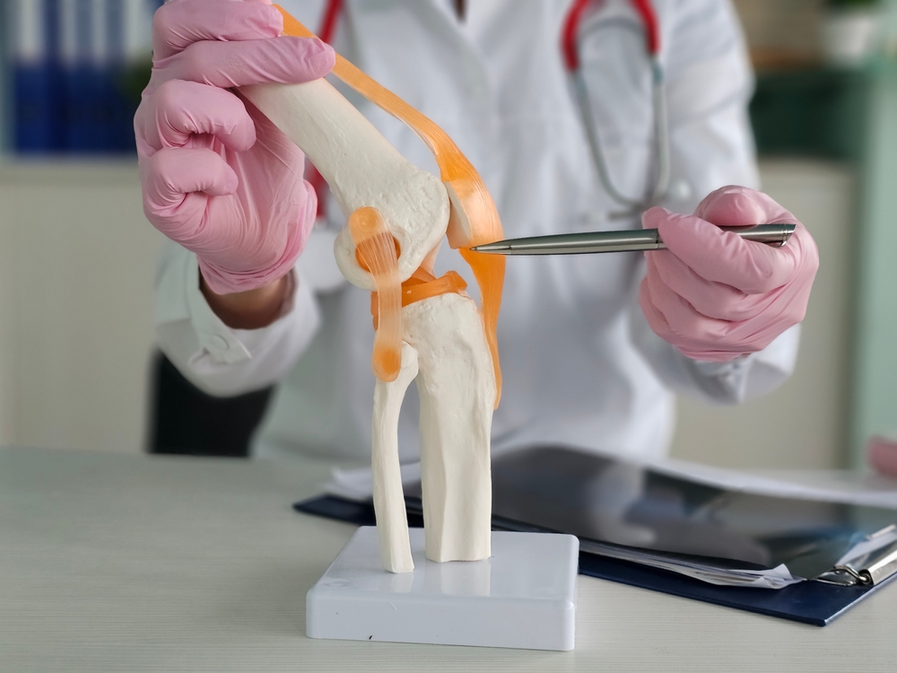 Joint replacement surgeon performing advanced total joint replacement procedure