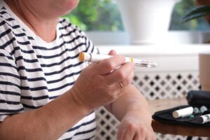 Healthcare provider explaining type 1 diabetes treatment insulin therapy to patient