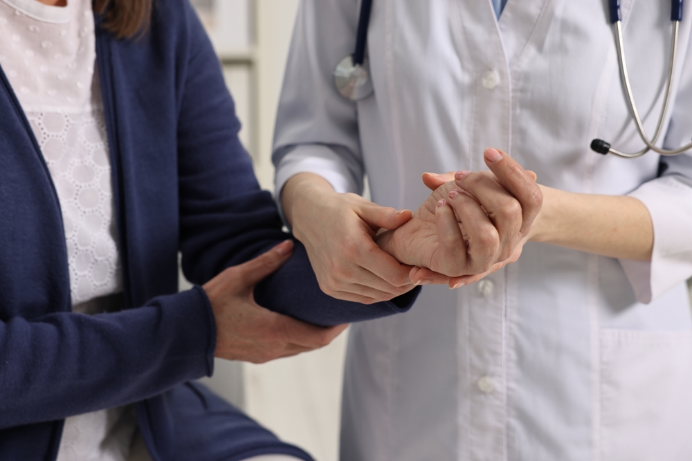 Doctor examining painful joints during arthritis treatment consultation's swollen joint during arthritis treatment consultation