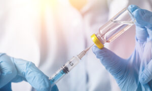 Healthcare provider administering therapeutic injection to patient in clinical setting