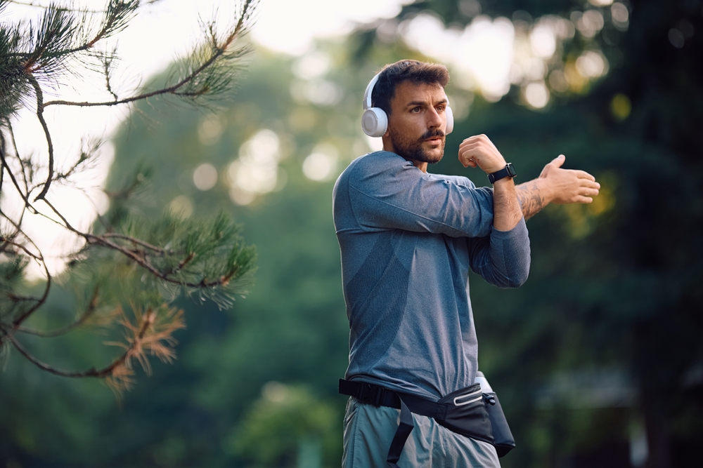 Athlete performing stretching exercises showing improved mobility from peptide treatment