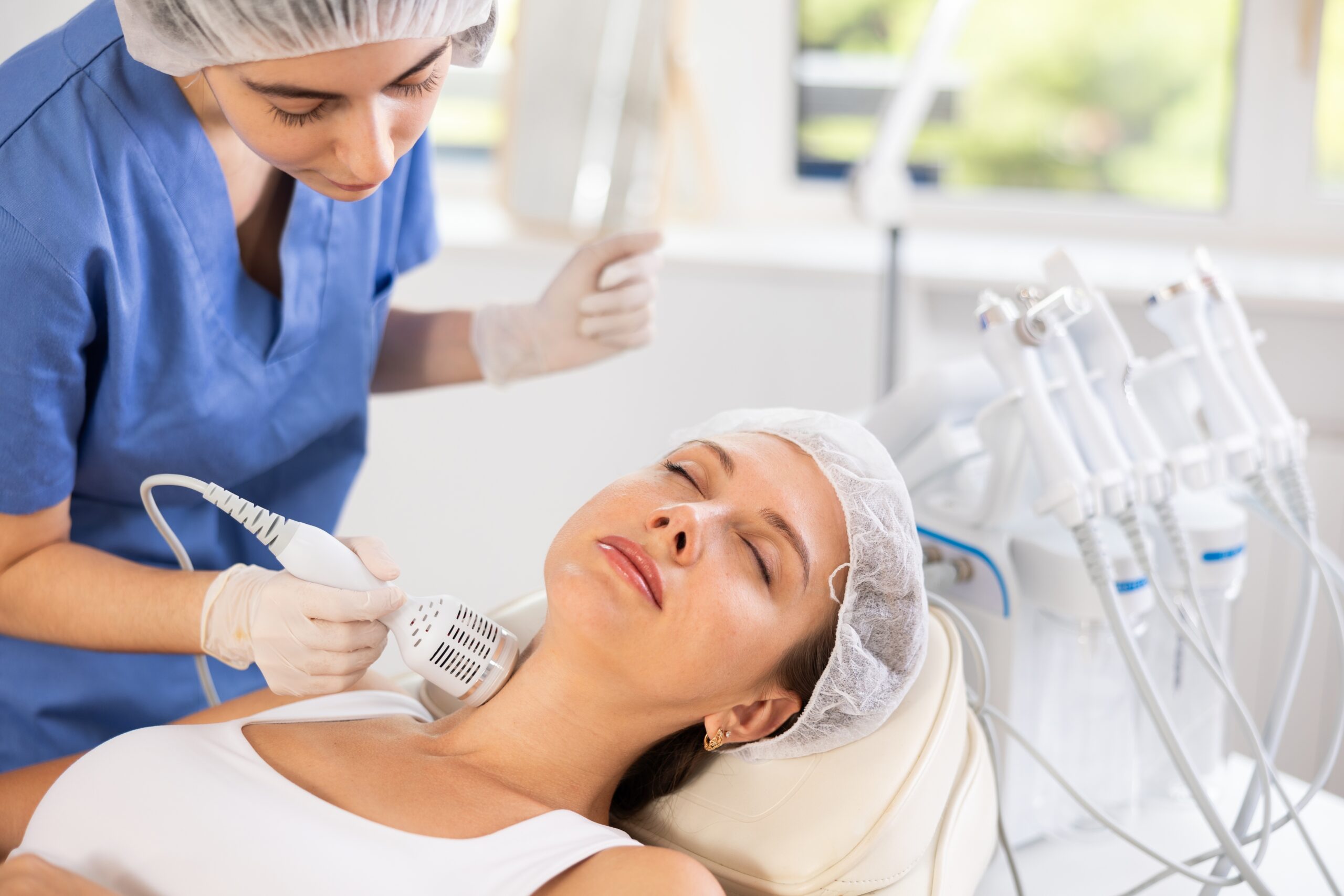 Woman relaxing during professional cryotherapy session with specialized cooling equipment
