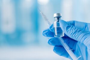 Person administering GAC lipotropic injection for weight management support