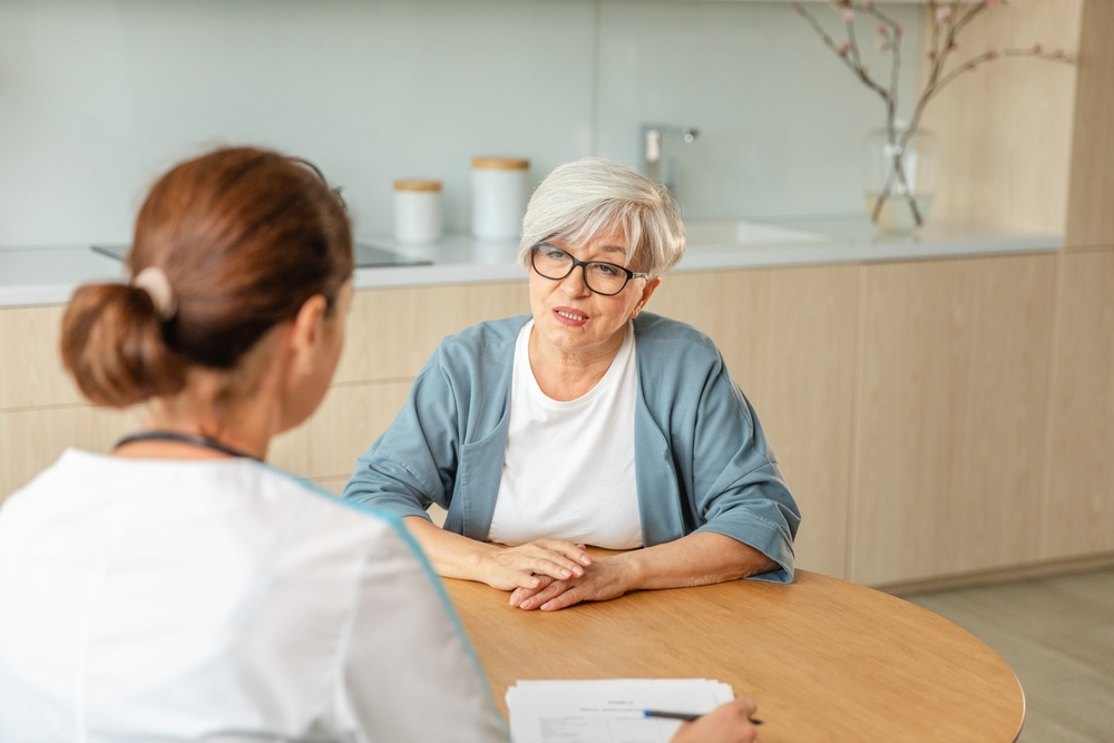 Doctor discussing NAD+ peptide injection treatment with patient