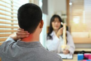 Patient consulting with neck pain specialist about treatment options