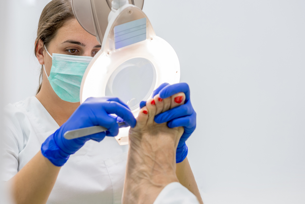 Surgical team conducting podiatric foot surgery procedure