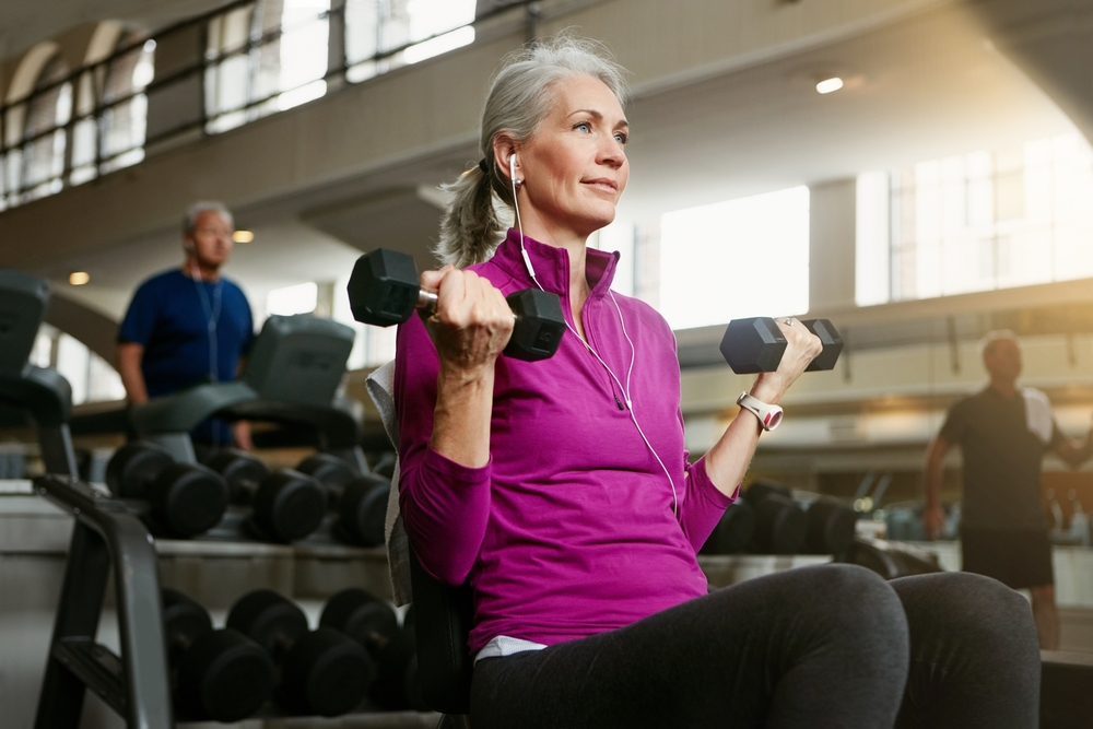 Healthcare provider discussing post menopausal osteoporosis treatment with patient