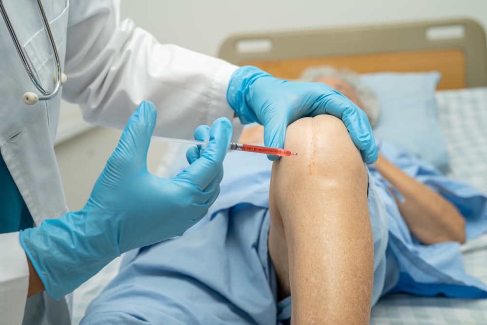Healthcare provider drawing PRP into syringe for injection therapy