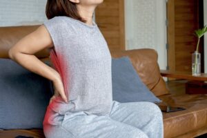 Person experiencing sciatic nerve pain requiring treatment evaluation