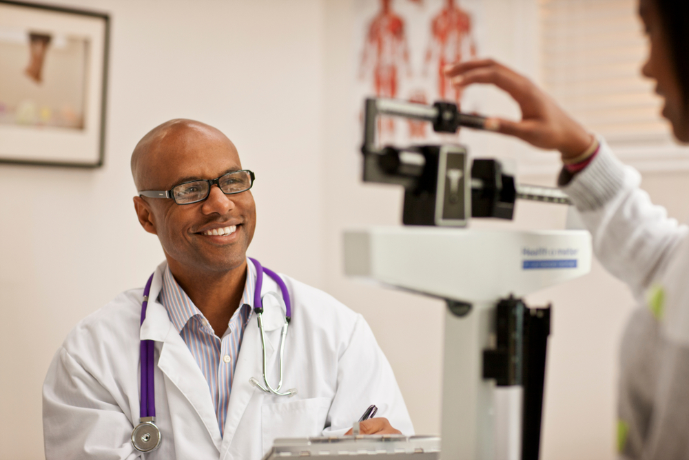 Healthcare provider conducting Seca body composition analysis on patient