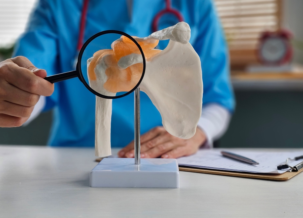 Healthcare provider examining patient during shoulder injury treatment nj consultation