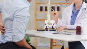 Spinal cord injury doctor reviewing imaging with patient