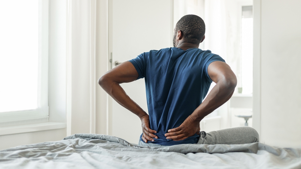 Physician administering stem cell therapy to patient's spine