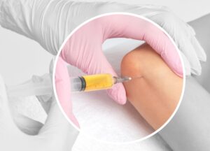 Medical provider administering stem cell injection to patient's knee