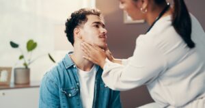 Physical therapist treating patient with tech neck and forward head posture
