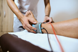 Patient receiving lower extremity neuropathy evaluation and treatment