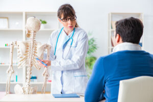 Healthcare provider evaluating rib pain during rib injury treatment consultation