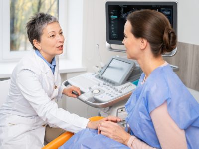 Happy mature woman demonstrating vitality from hormone replacement therapy