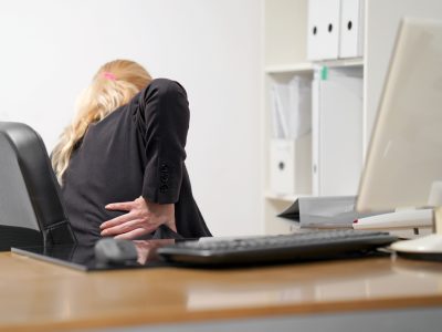 Doctor examining hip joint during pain management for hip pain consultation