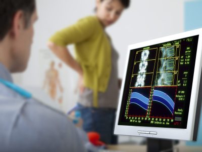 Doctor reviewing bone density information during patient consultation