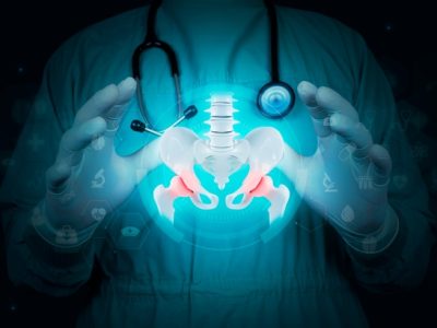 Minimally invasive hip replacement surgeons consulting with patient about procedure