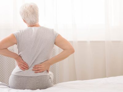 Doctor reviewing bone density results with postmenopausal patient