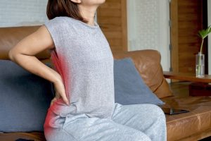 Person experiencing sciatic nerve pain requiring treatment evaluation