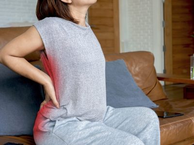 Person experiencing sciatic nerve pain requiring treatment evaluation