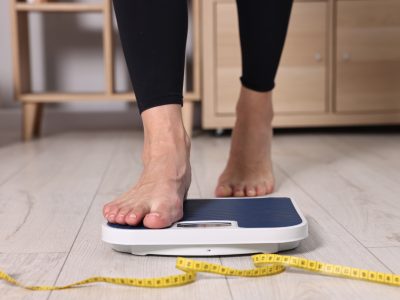 Patient using Seca body composition analyzer in medical office