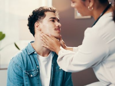 Physical therapist treating patient with tech neck and forward head posture