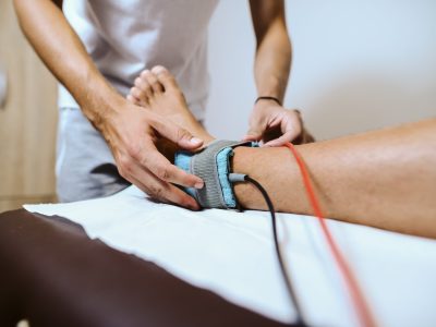 Patient receiving lower extremity neuropathy evaluation and treatment