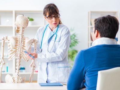 Healthcare provider evaluating rib pain during rib injury treatment consultation