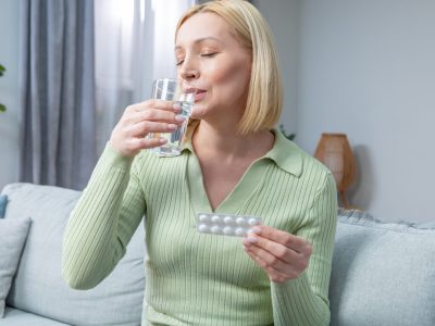Doctor consulting with female patient about hormone therapy options